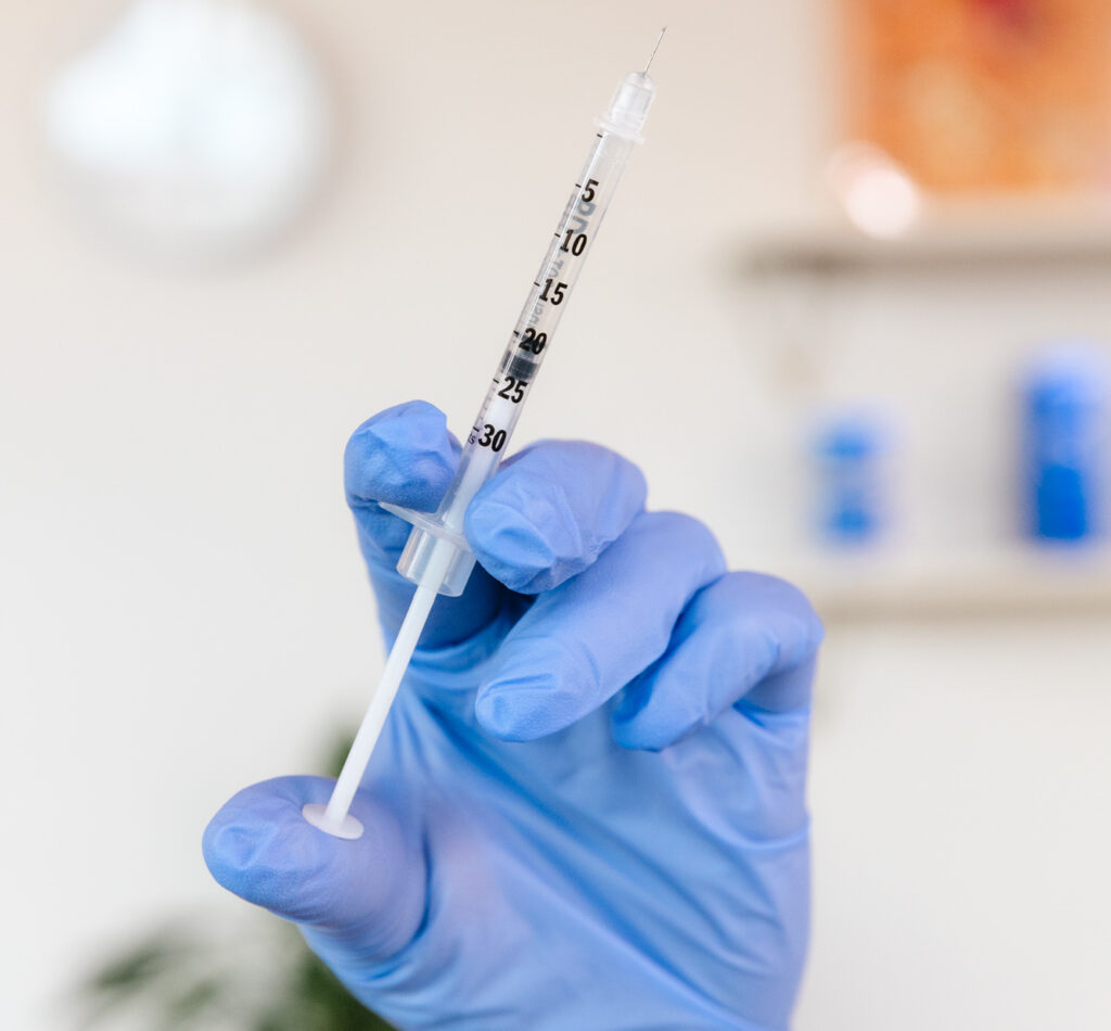 A provider wearing gloves prepares an injection with Botox in Brentwood, TN