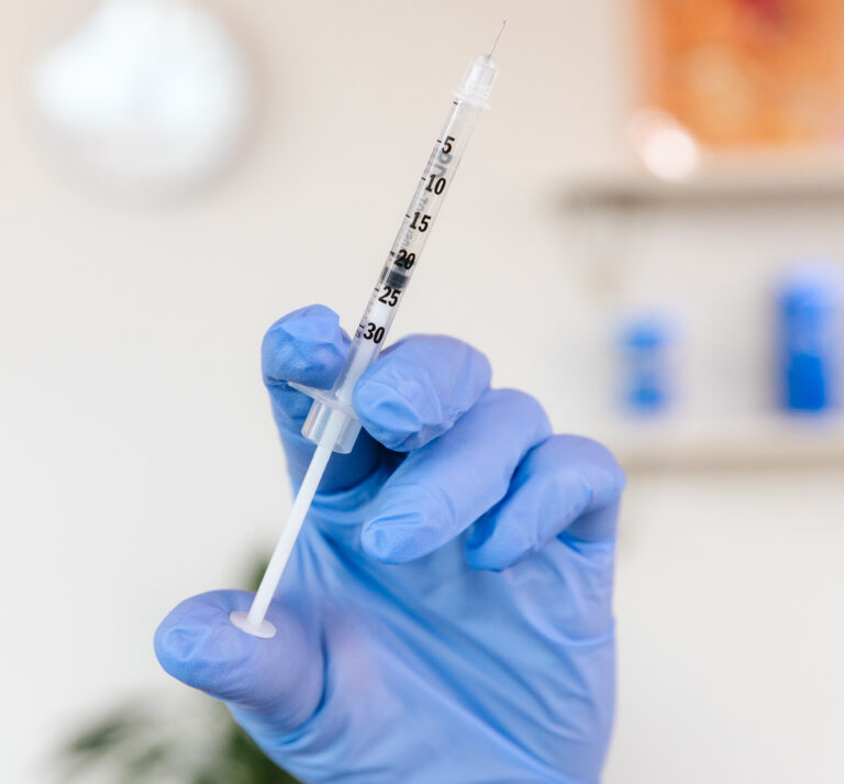 A provider wearing gloves prepares an injection with Botox in Brentwood, TN