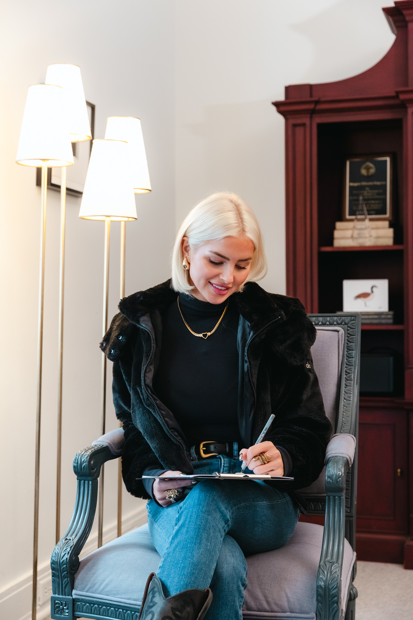 Woman signing paperwork